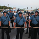 Police stand watch as demonstrators protest the shooting death of teenager Michael Brown Aug. 13, 2014, in Ferguson, Mo.
Scott Olson/Getty Images